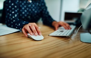 womans-hand-on-computer-mouse